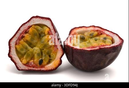Fresh passion fruit cut in half, showing juicy pulp and seeds. Tropical fruit concept, healthy food, natural nutrition, freshness. isolated on white, Stock Photo
