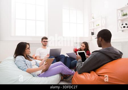 Students share opinions during break Stock Photo