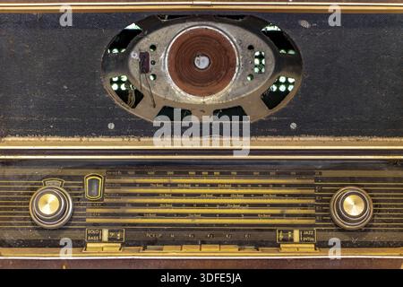 Obsolete radio in wooden case from Germany. Old fashion style vintage radio close up. Retro radio close-up Stock Photo