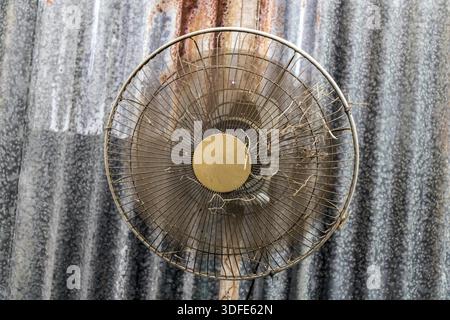 A old fan rotate on metal roof Stock Photo