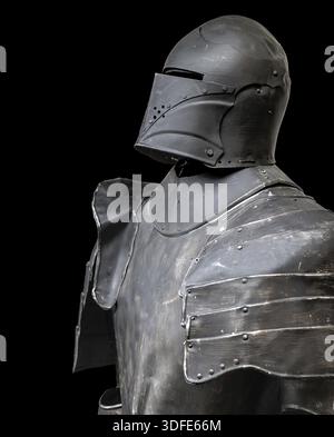 The iron armor for a knight on a black background Stock Photo
