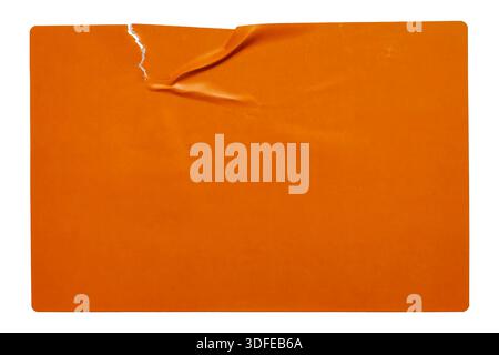 Blank orange rectangular sticker with torn corner and crinkled paper texture on white background Stock Photo