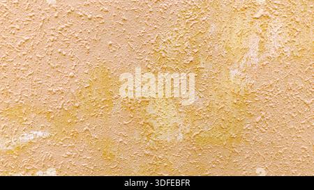 Distressed Beige and Yellow Stucco Wall Texture with Weathered Plaster Detail and Grungy Surface Stock Photo
