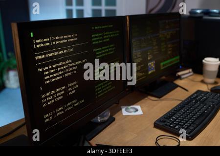 Close up of Computer Monitors Displaying Surveillance Camera Code Running Stock Photo