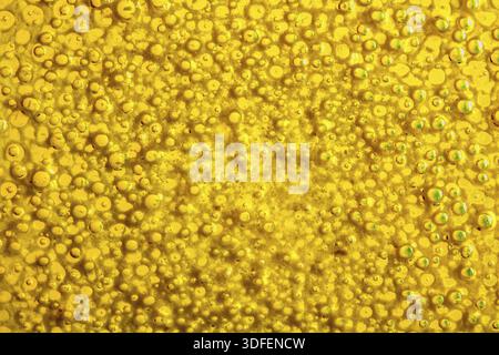 Colorful bubbles of fluid on glass surface Stock Photo