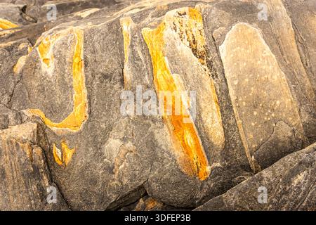 When this granite rock was relieved of its weight by the melting ice shield, it 'bounced' back up. amazing patterns, even formed letters are revealed. Stock Photo
