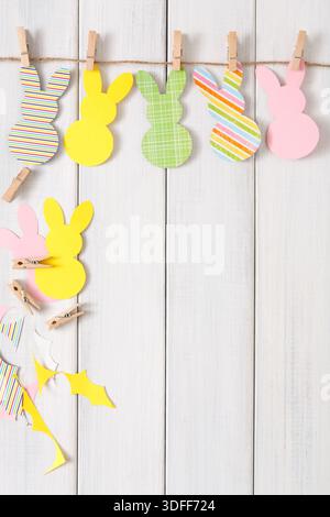 Colorful Paper Bunny Decorations Hanging on a String for Easter Celebration Stock Photo