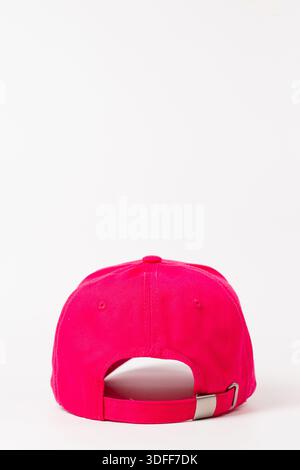 Back view of pink baseball cap with buckle on white background. Stock Photo