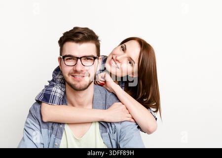 Happy casual couple posing to camera, isolated Stock Photo