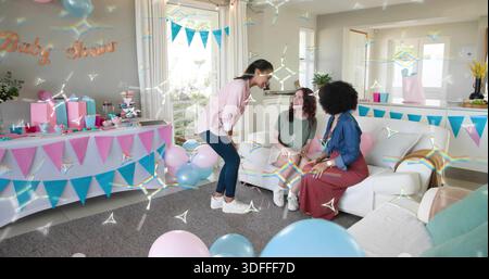 Chatting three women in casual party clothes gathering on sofa in living room, with balloons Stock Photo