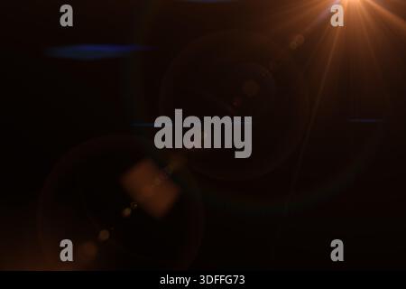 Sun flare on black. Abstract circle Digital lens Flare, light leaks. Solar lens flare effects. Abstract overlays background. Stock Photo