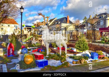 Modern reindeer and wrapped presents display as part of festive Christmas decorations - La Roche Posay, Vienne (86), France. Stock Photo