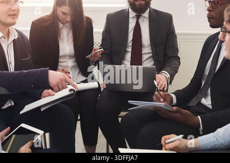 Business Meeting With Professionals Discussing Strategies in an Office Setting Stock Photo
