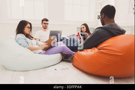 Students share opinions during break Stock Photo