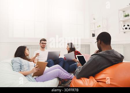 Students share opinions during break Stock Photo