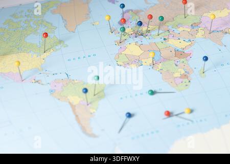 World map with colorful pushpins showing locations for global travel and planning Stock Photo