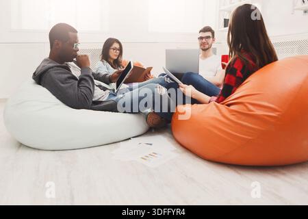 Students share opinions during break Stock Photo