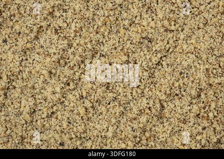 Macro crushed walnut kernels top view. Stock Photo
