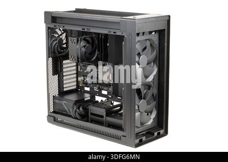Side view  big tower, PC case, chassis,  inside motherboard, CPU, fan, SSD, memory, power supply unit with cables, isolated on white Stock Photo