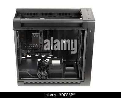 Side view  big tower, PC case, chassis,  inside motherboard, CPU, fan, SSD, memory, power supply unit with cables, isolated on white Stock Photo