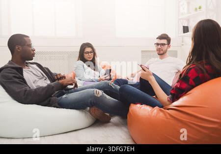Creative professional designers discussing ideas Stock Photo