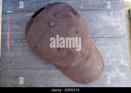 Green cap on a gray cement surface Stock Photo