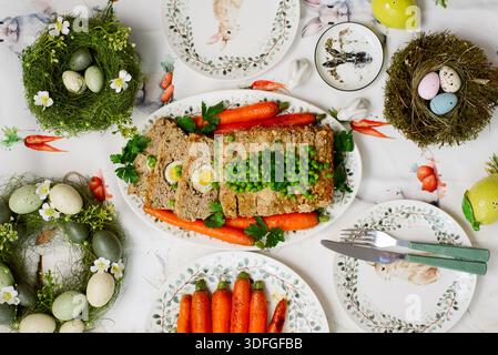 Easter meatloaf with egg, carrots, green beans .top veiw.selective focus Stock Photo