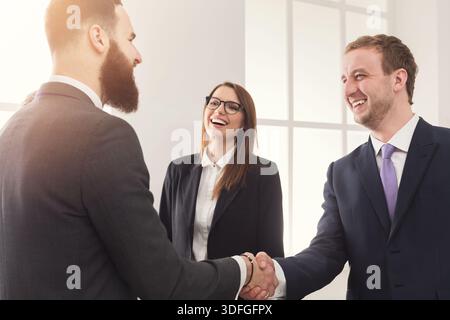 Business handshake at multiethnic office meeting Stock Photo
