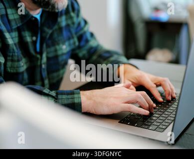 Middle Aged Coder Man Vibe Coding in Artificial Intelligence Infused Integrated Development Environment - Software Engineer Uses AI Based IDE Concept Stock Photo