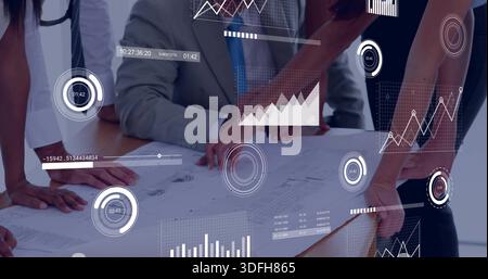 Leaning three professionals in suit, sleeveless dress pointing to plan in office, HUD overlays Stock Photo