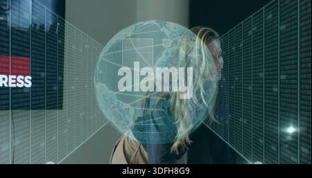 Walking woman in blazer carrying shoulder bag through data aisle, passing server racks, hologram Stock Photo