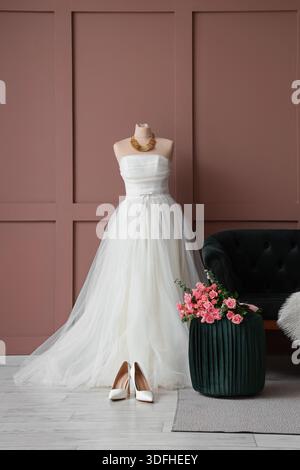 Interior of room with wedding dress, high heels and roses Stock Photo