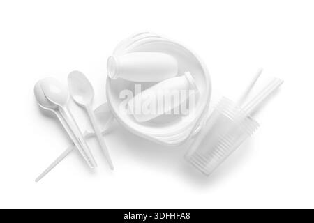 Different plastic tableware on white background Stock Photo