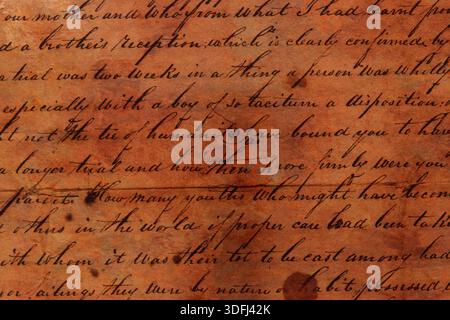 Handwriting on an antique letter written on grunge paper. Old calligraphy handwriting background backdrop. Stock Photo