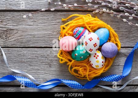Colorful Decorated Eggs Arranged in a Nest for Easter Celebration in Springtime Setting Stock Photo