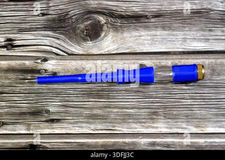 Electroprobe, a voltage tester screwdriver, a standard screwdriver with an internal resistor and neon lamp to safely test for the presence of AC volta Stock Photo