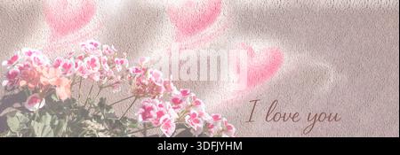Pink geranium flowers with projected heart lights and romantic light message on wall Stock Photo
