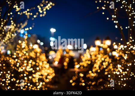 Abstract background of blurry city lights or bokeh lights at night. Blurry Christmas string lights, out of f Stock Photo
