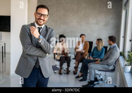 Professional in office environment, highlighting teamwork, collaboration, leadership, and innovation Stock Photo