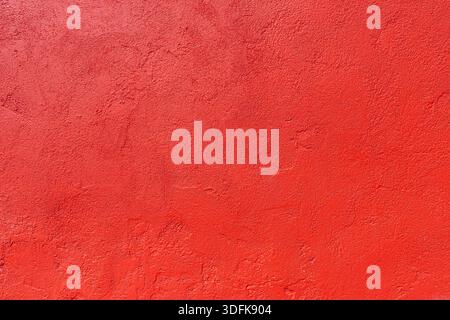 Texture of an old red plastered wall. Abstract construction background. Stock Photo