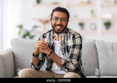 Handsome middle-eastern millennial man posing at home Stock Photo
