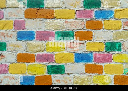 Wall made of multi-colored bricks. Abstract design background. Stock Photo