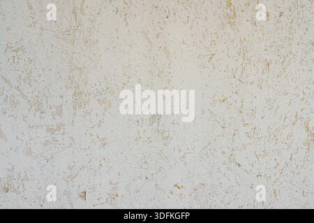 Peeled plaster on the wall. Abstract construction background. Stock Photo