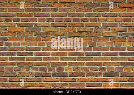 Old orange brick wall. Abstract interior background. Stock Photo
