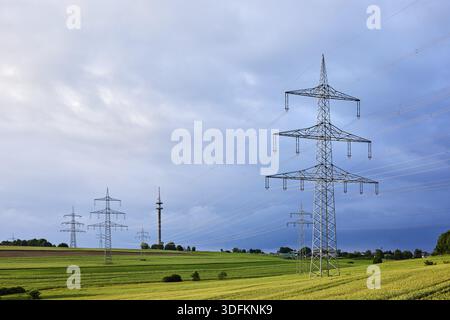 Landscape, high-voltage pole, high-voltage line, fields, trees, bushes, cloudy, sunny, stratocumulus clouds, cumulonimbus clouds, thunderstorm, Raling Stock Photo