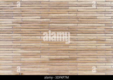 New, rustic brown and beige brick or tile wall. High quality texture and background for your projects and creative work Stock Photo