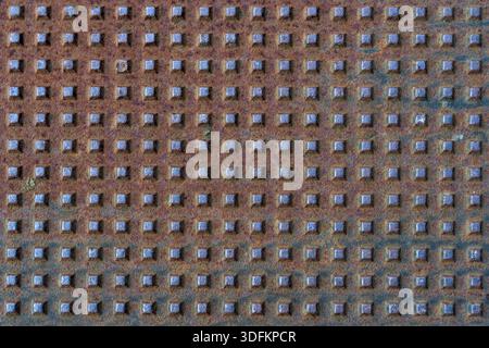 Square shapes on rusted metal surface with patterns and cracks. high quality texture and background for your projects and creative work Stock Photo