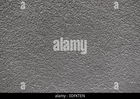Close-up of a gray concrete wall with rough texture, suitable as an abstract architectural background Stock Photo