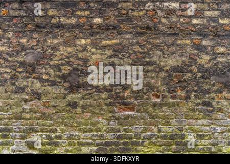 Old, rustic red corroded and damaged brick wall. High quality texture and background for your projects and creative work Stock Photo