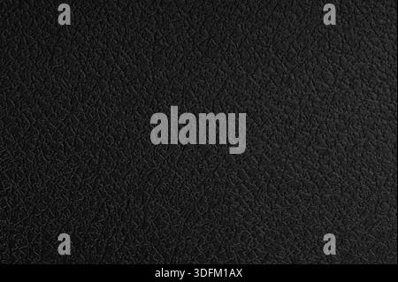 Black rough plastic texture abstract pattern macro close up view Stock Photo